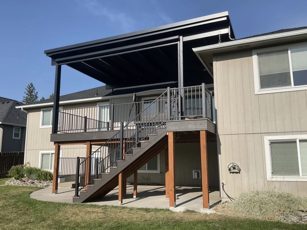 Attached motorized louvered pergola over a finished residential deck
