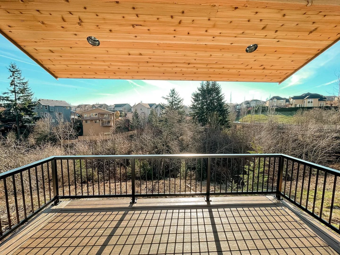 Black aluminum deck railing framing a finished elevated deck